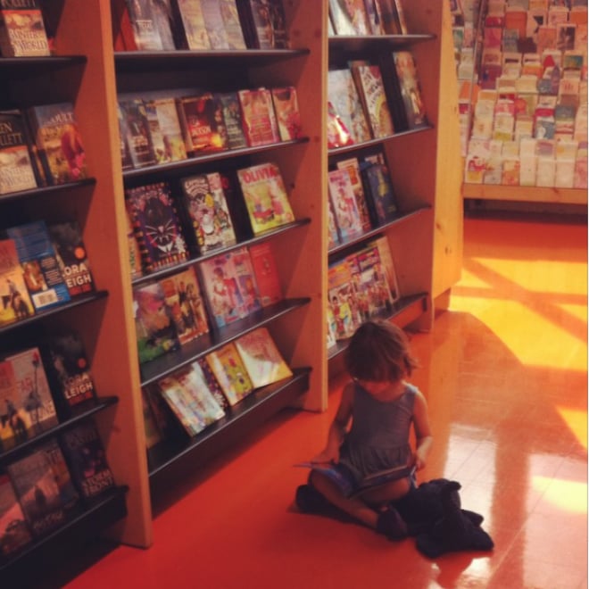 Violet at 3 distracted by the book aisle.