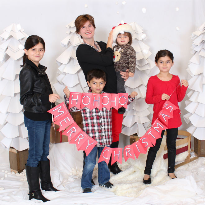 Alison and her kids celebrating Christmas in 2013. Photo courtesy of Alison Azer.