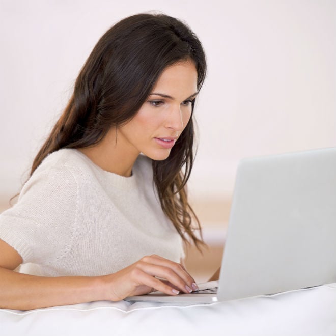 woman typing on computer