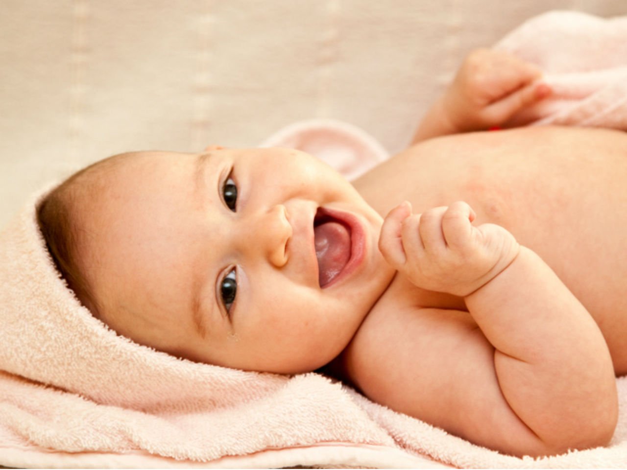 When do babies first smile?