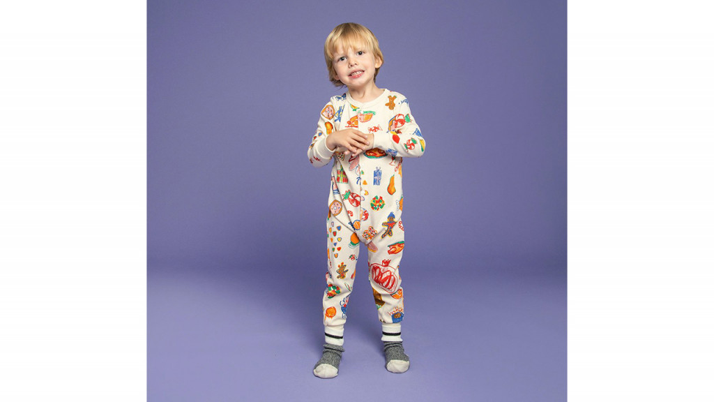 Kid wearing a colourful designed onesie