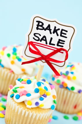 Photo of a cupcake with a "bake sale" sign