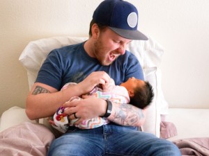 New dad holding newborn