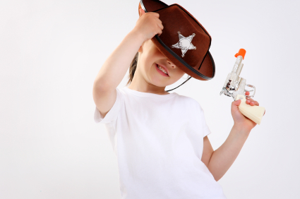 Photo of a kid holding a gun