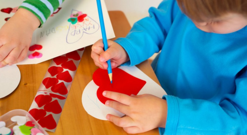 Child making a Valentine's Day card