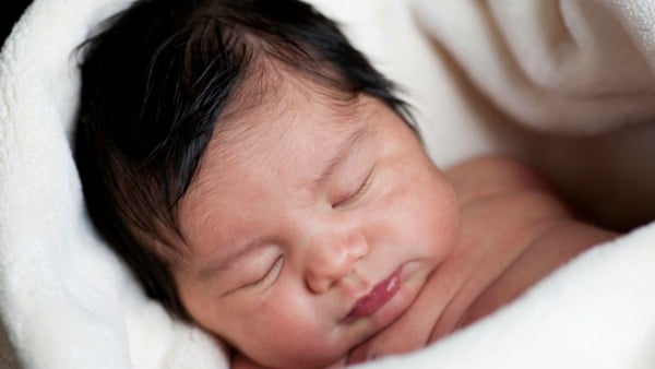 Baby born with hair sleeping