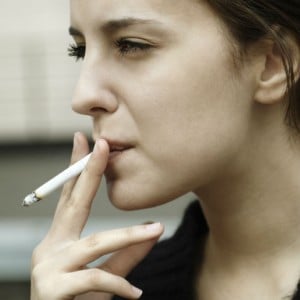 Close-up photo of a woman smoking