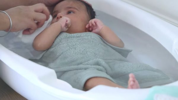 Photo of a baby getting a bath