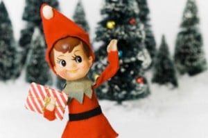 elf on the shelf in front of a wintry background