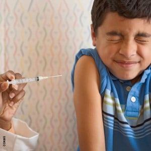 Photo of a little boy about to get a shot