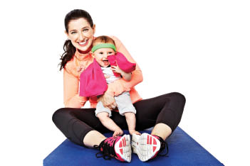 mom on exercise mat with baby