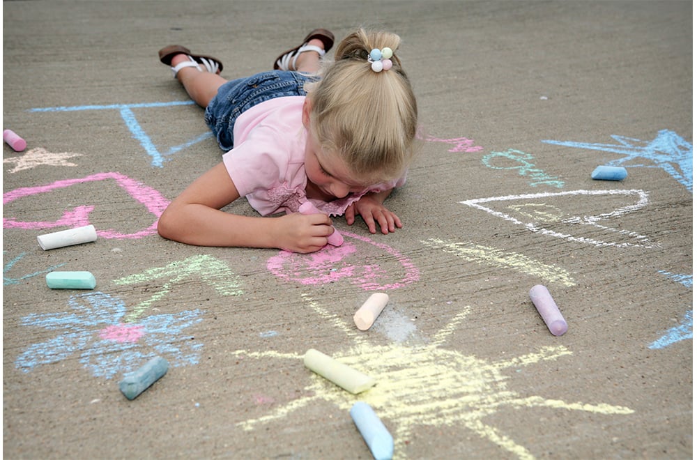 Toddler Girl Drawing With Chalk Outdoors Stock Photo 