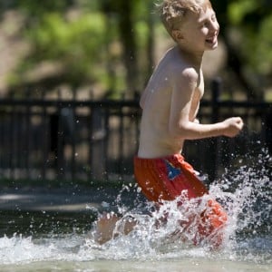 kids splashing in a wading pool