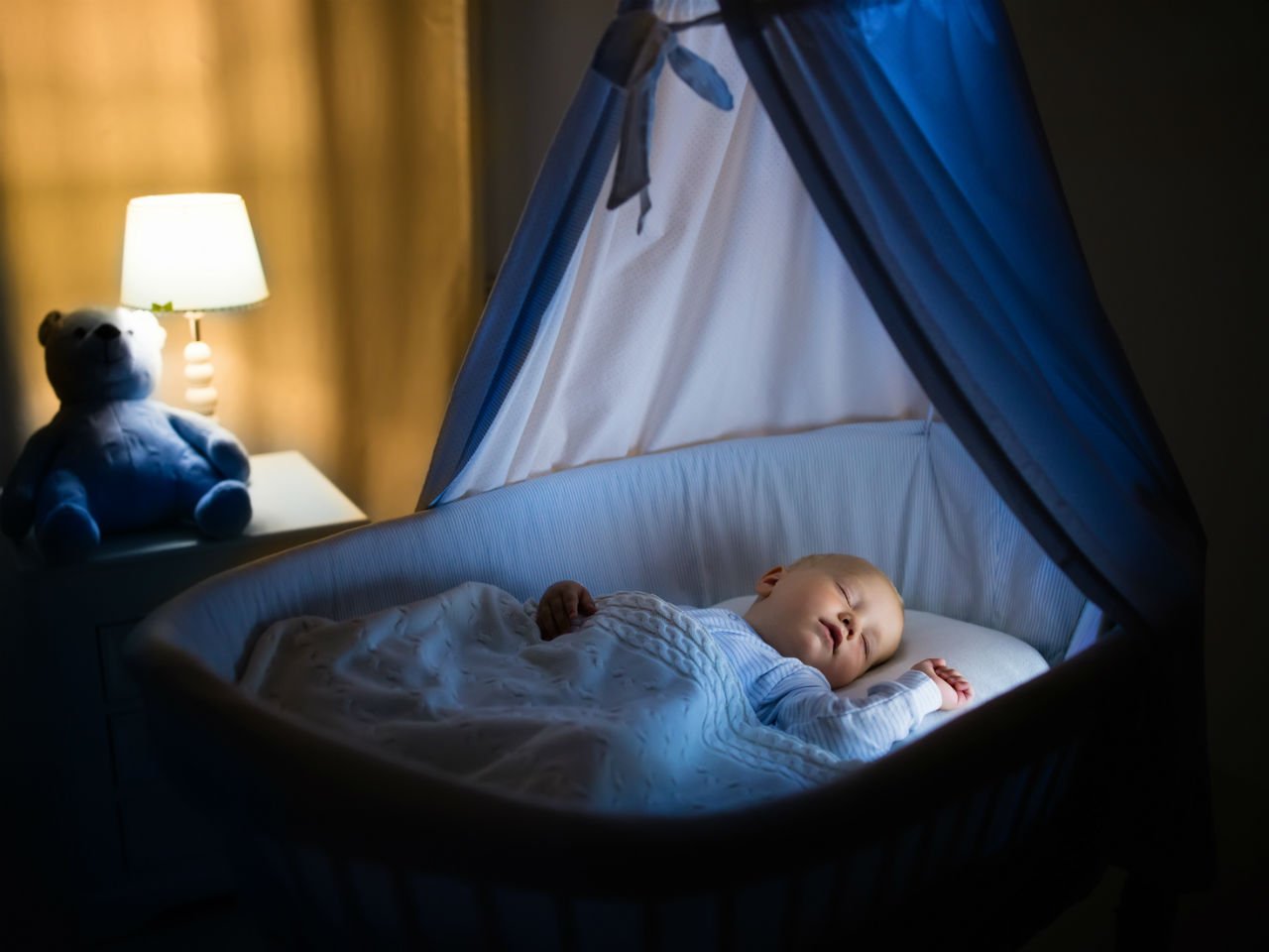 Baby sleeping in a bassinet
