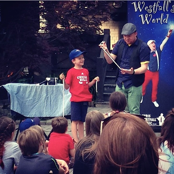 magician chris westfall performing at an event for children