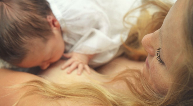 Mother breastfeeding her newborn