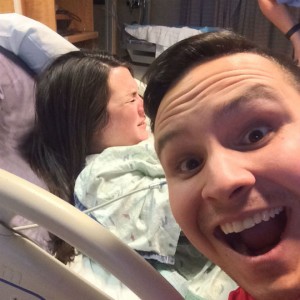 dad taking a selfie while mom is in labour