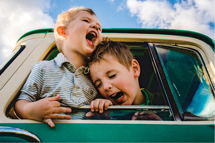 two kids in a car