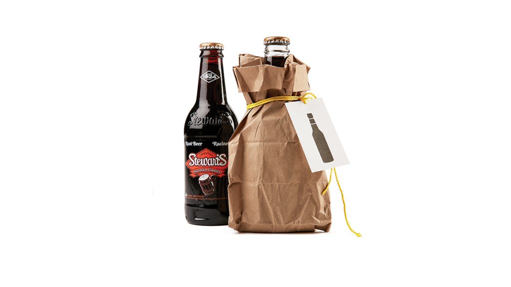 Root beer bottles wrapped in paper bags