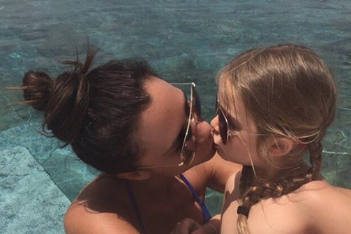 Victoria Beckham criticized for kissing Harper on the lips