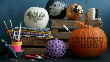 A bunch of pumpkins with different words and pictures them