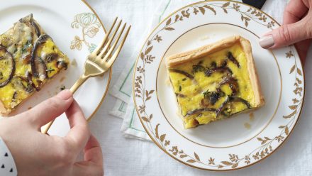 china plate with square of crusted quiche