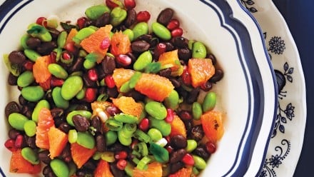 bowl of salad with beans and oranges