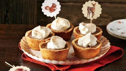 plate with pumpkin pie tarts and cute toppers