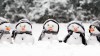 A row of tiny snowman outside