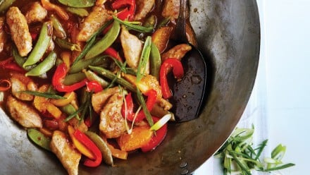 Wok with marinated pork, red peppers, snow peas and green onion