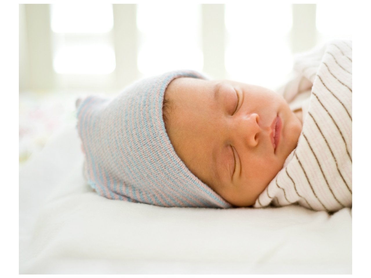 Newborn sleeps safely in crib