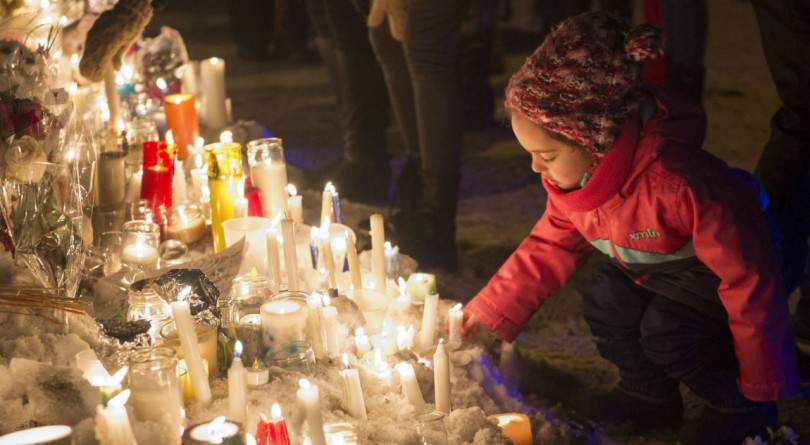 child at a candlelit vigil