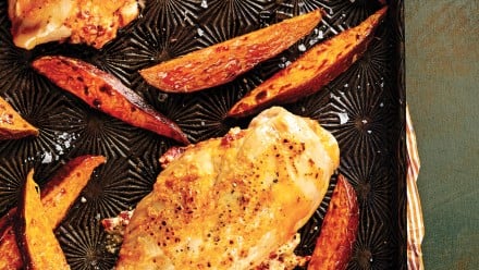 baking pan with sweet potatoes and chicken breast
