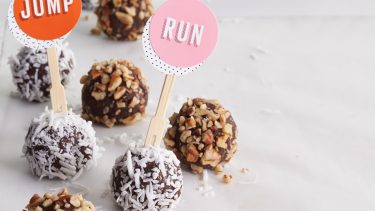 chocolate balls covered in nuts and coconut