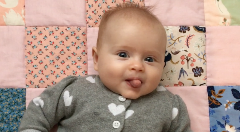 happy baby with tongue out