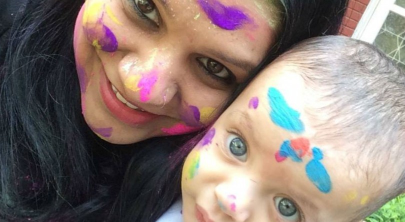 Mom and her baby splashed in colours while celebrating Holi in India