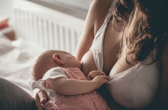 A woman breastfeeding her baby