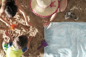 Family digging in the sand