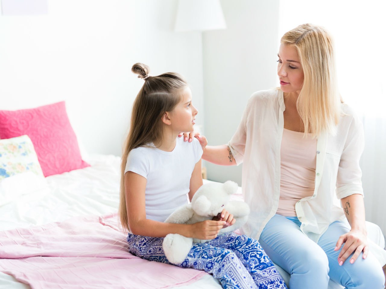 Mom talking about mental health with daughter
