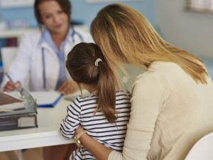 Woman at the doctor’s with her daughter