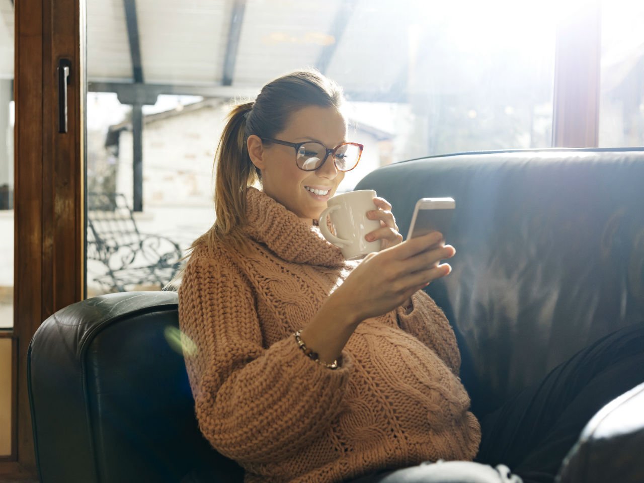 Pregnant woman looking at her phone