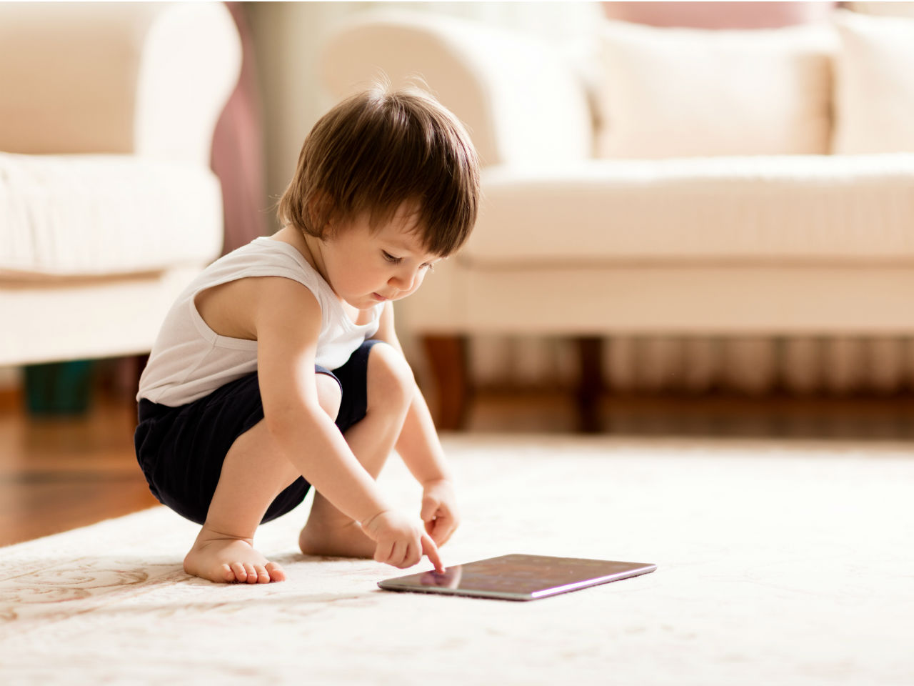 Toddler using iPad