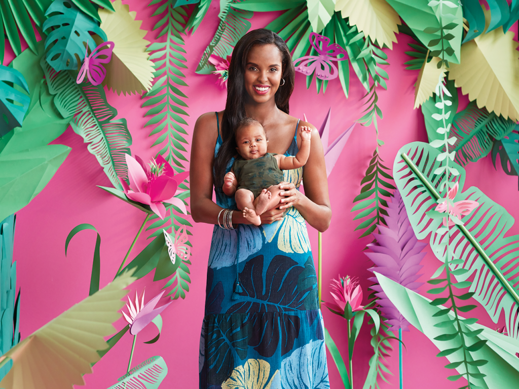 woman holding a baby in long maxi dress