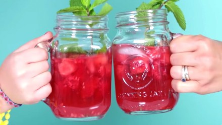 Two glasses of watermelon sangria. One for kids and one for adults
