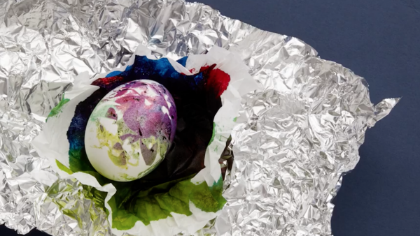 A tie-dye Easter egg in tinfoil