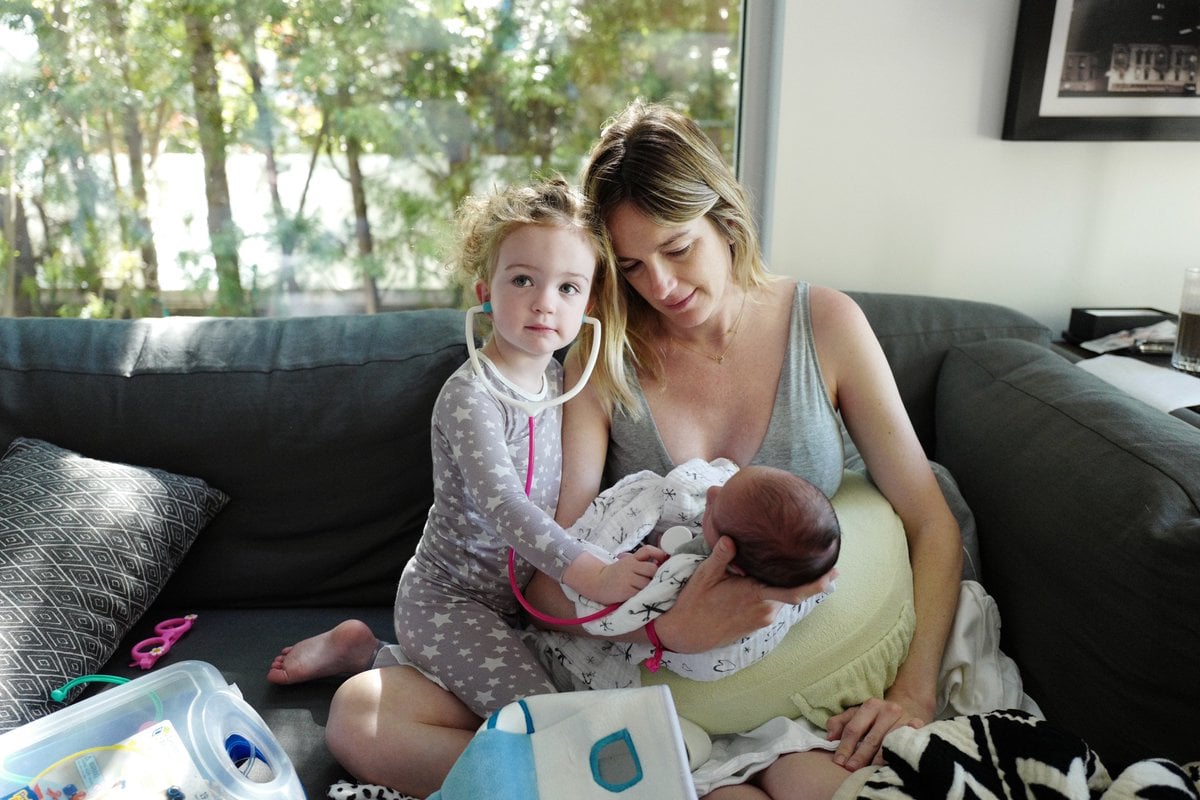 Jimmy Kimmel's wife holding their baby son and daughter