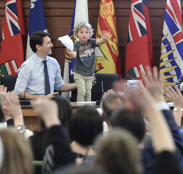 Hadrien and Justin Trudeau making a speech