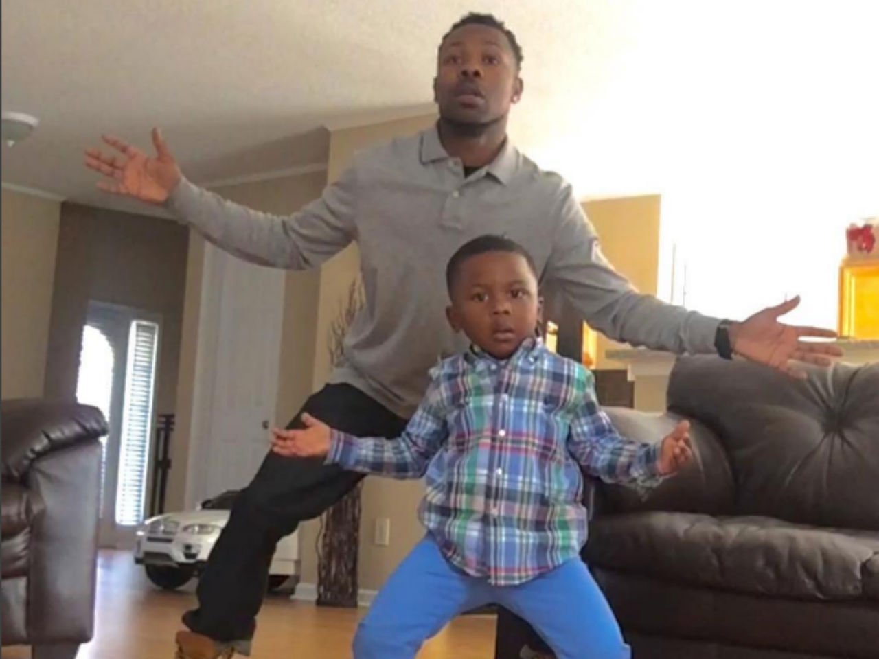 father and son sing and dance to hip hop songs together