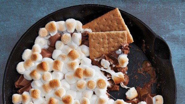 cast-iron pan with melted chocolate and marshmallow