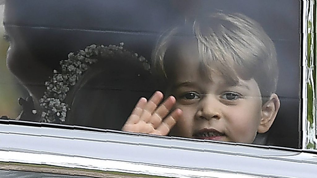 Prince George in a car waving goodbye
